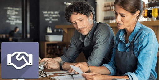 Business owners working on tablet with Odoo CRM icon