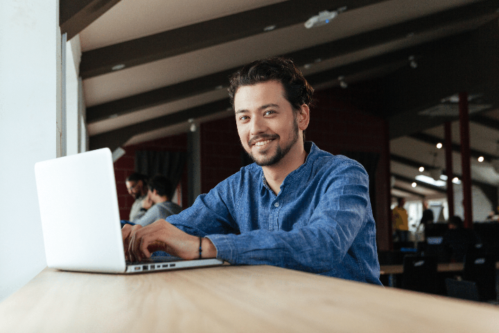 Happy male on laptop